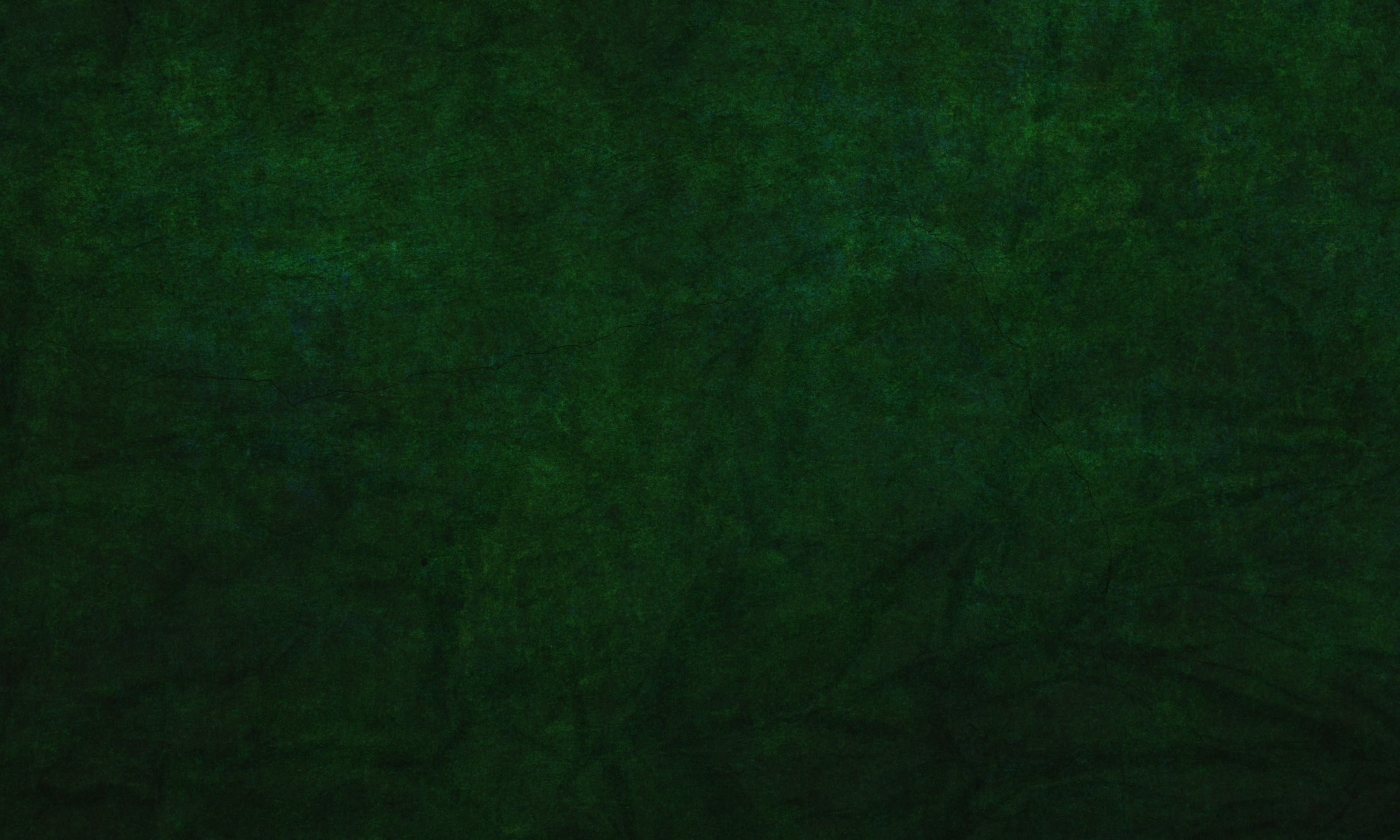 Dark green textured paper background.