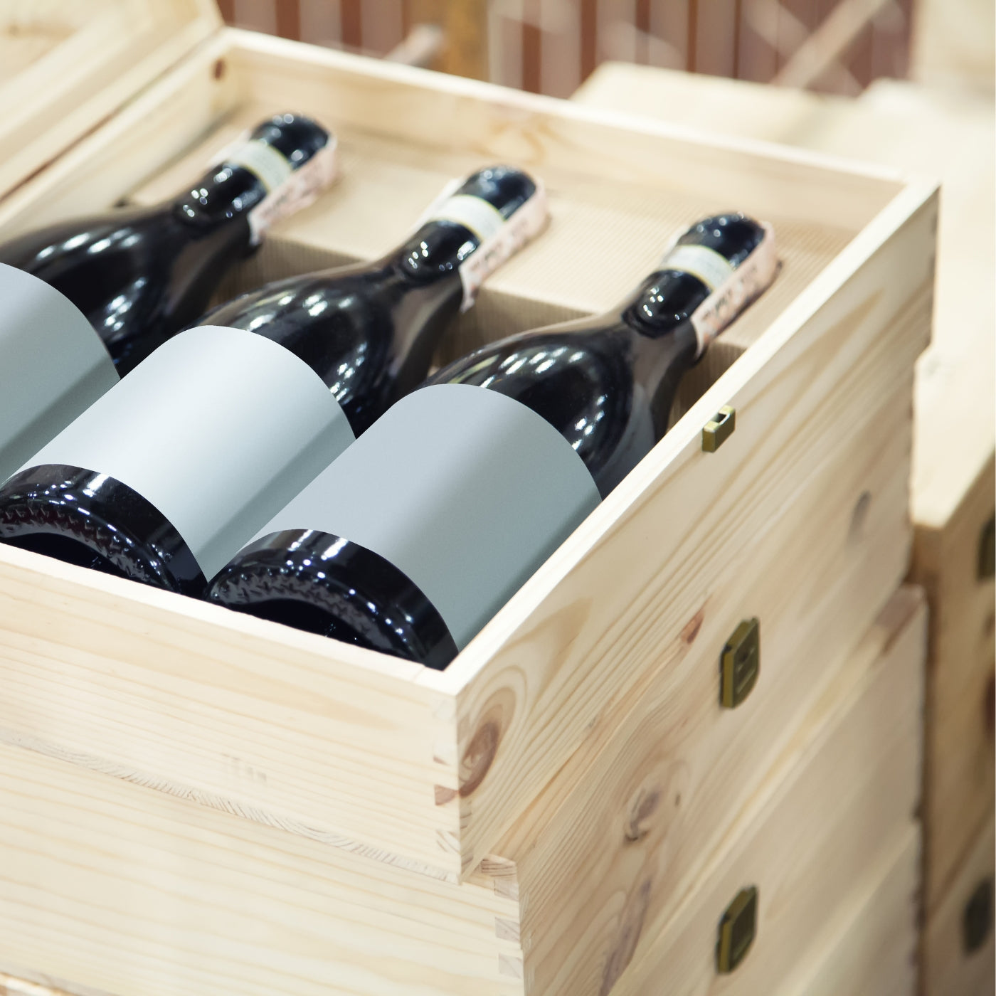 Bottles of wine neatly arranged in a wooden box, ready for delivery or display in a wine store.